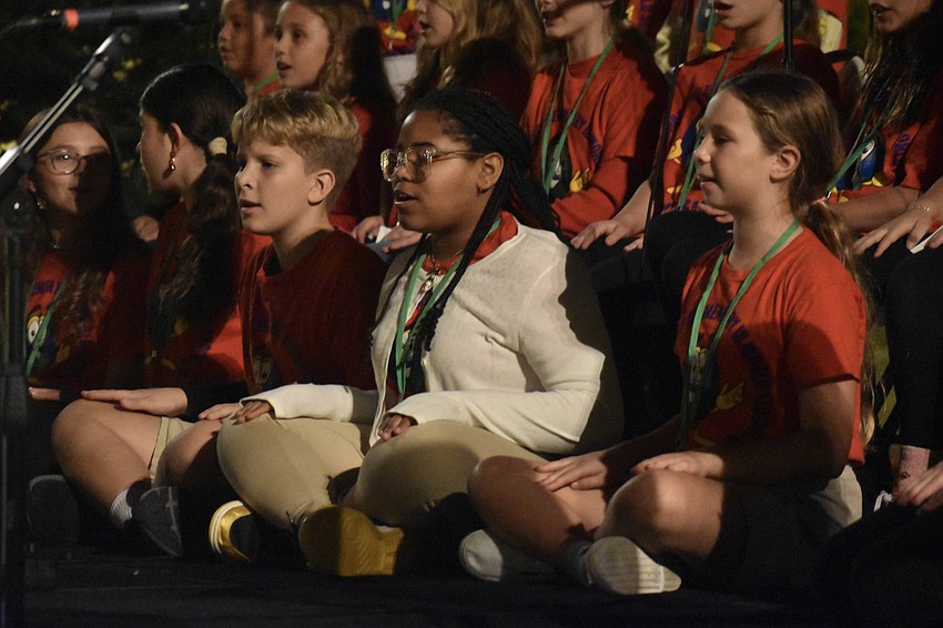 Students from Phillippi Shores Elementary School, including Fifth graders Matthew Vinson and Kadence Butler and fourth grader Genevieve Stickley offer a performance.