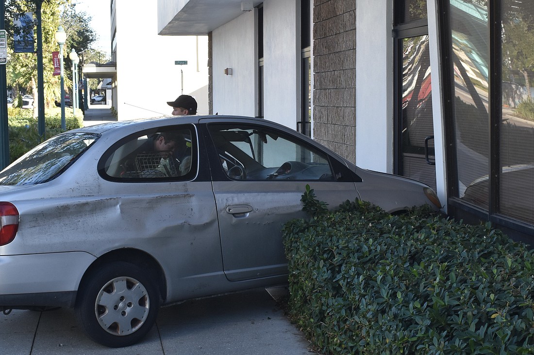 The vehicle crashed into the side of the office around 4 p.m. on Sunday.