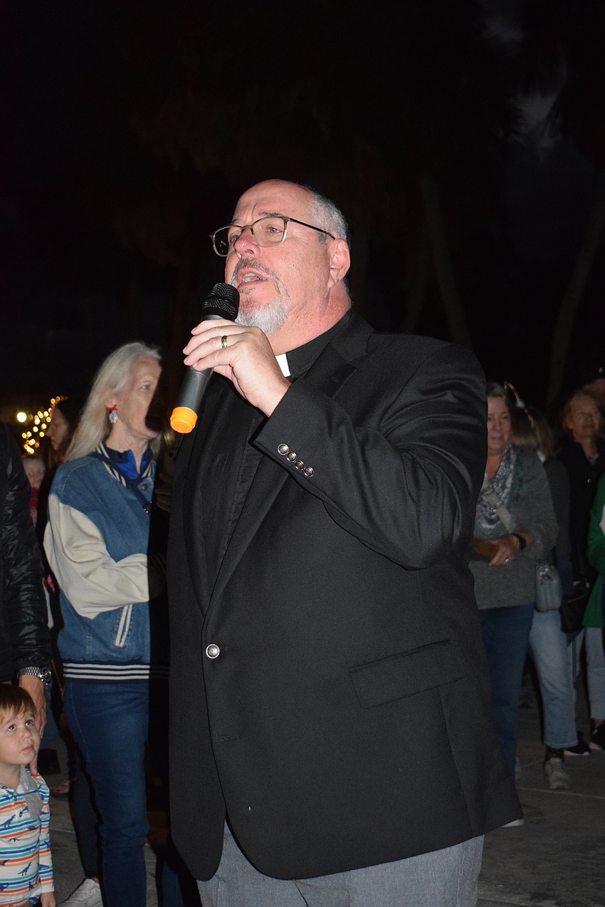 Rev. Kenneth Blyth led the crowd in prayer.