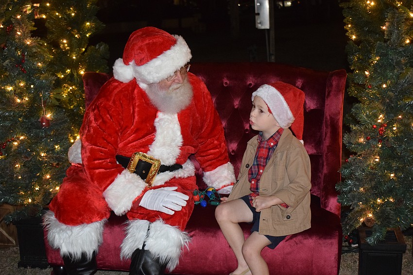 Waylon Wilson chats with Santa Claus at the St. Armands Holiday Night of Lights.