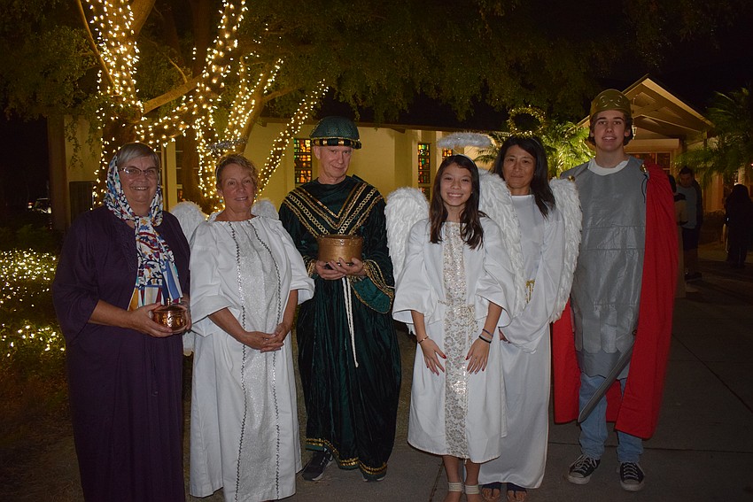 Bard Dzumela, Sandi Love, David Lawrence, Anjoy Bukmier,Sae Burkmier and Caleb Overholt walk around St. Armands Key Lutheran Church during the live nativity.