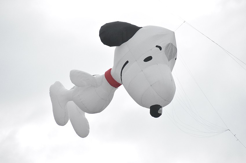 Snoopy takes flight above the festival.