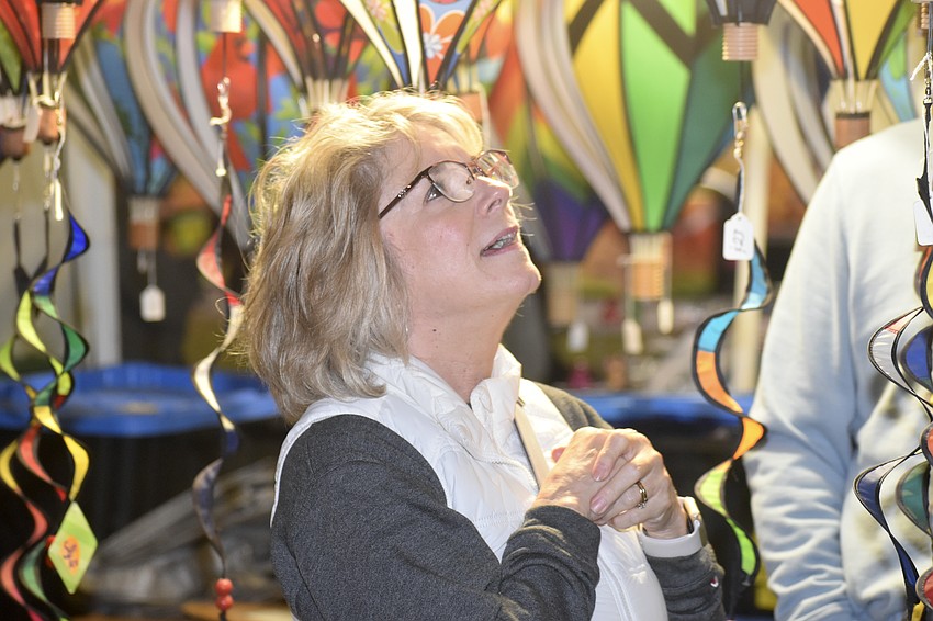 Anne Parker admires balloon-inspired decorations at one of the vendor booths.