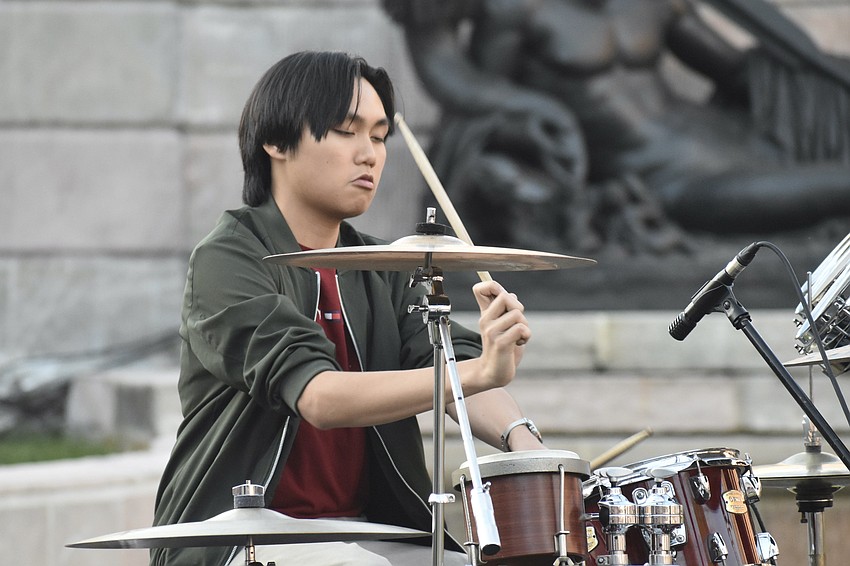 Booker High School senior Tristan Tran plays drums with the band Category 5.
