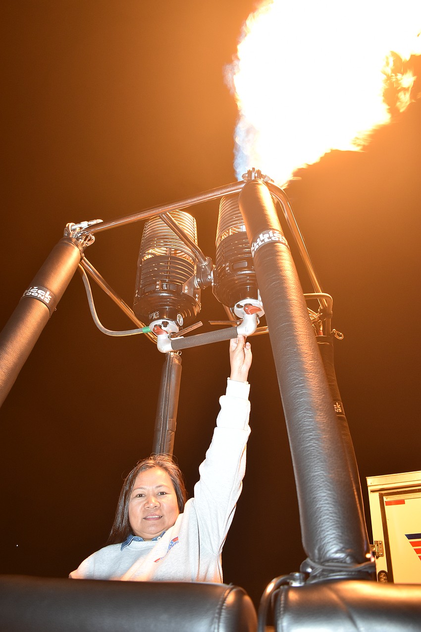Tess Schmitt of Maverick Balloon Adventures fires up the propane.