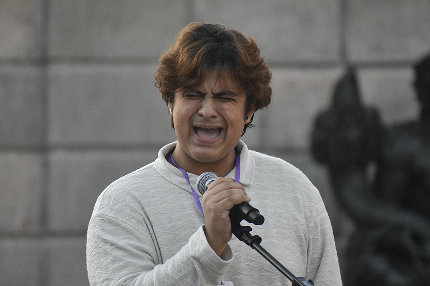 Booker High School senior Kyle Ramon, of the band Category 5, offers a solo.