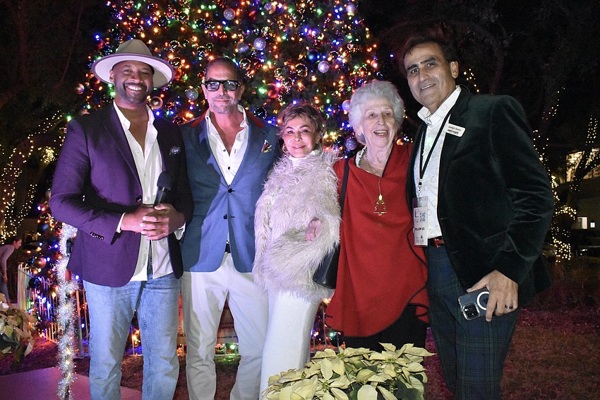 Commissioner Kyle Battie, Downtown Improvement District Vice Chair Ronnie Shugar, Chair Chris Voelker and board member Eileen Hampshire, and Next-Mark President Joseph Grano.