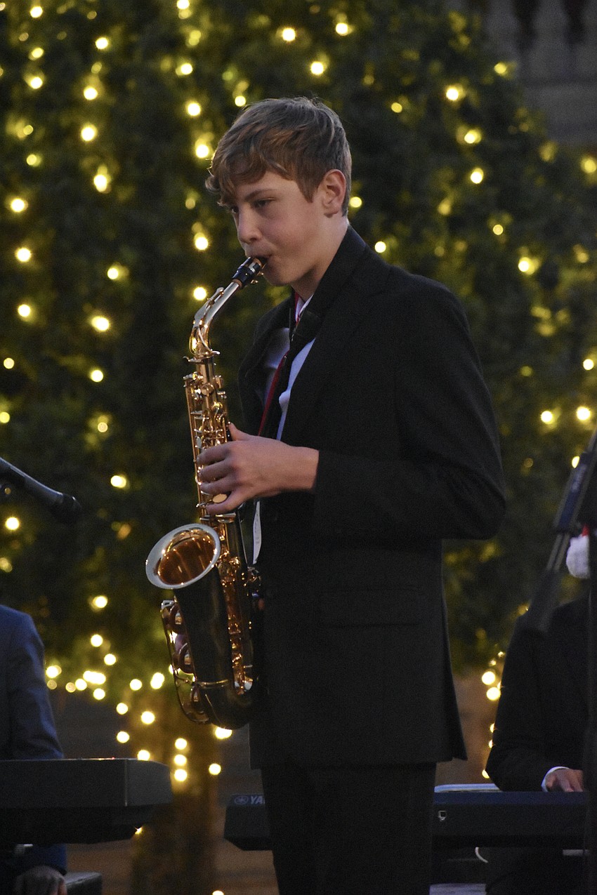 Sarasota Middle School freshman Eric Glushenkov performs on saxophone with the Southside Elementary band led by his father Sergei Glushonkov.