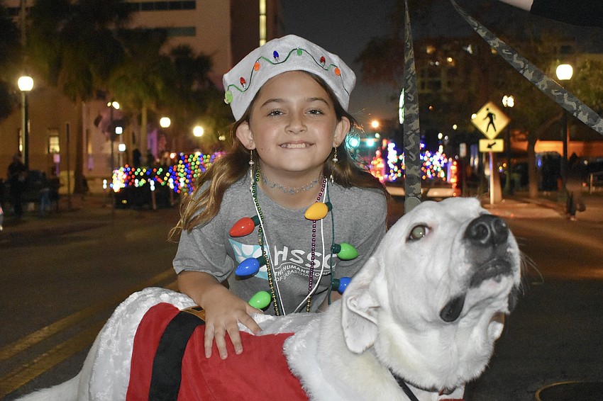 Emilia Wilson, 9, and Rocket, walked with the Humane Society of Sarasota Conunty.