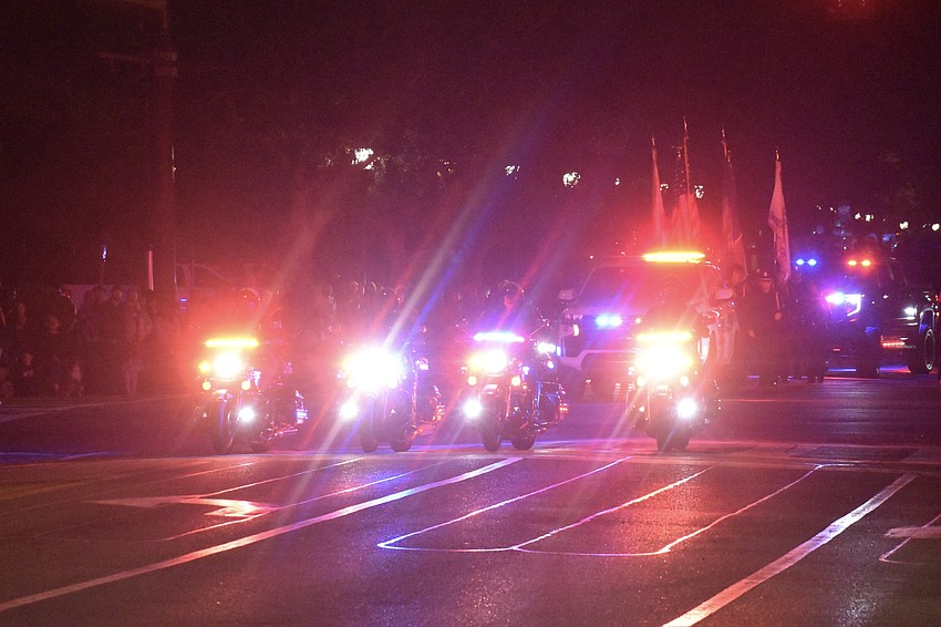 The police prepare to escort the parade.