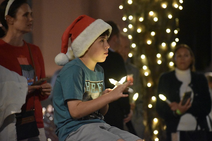 Brooks Pukajlo, 8, watches a performance.