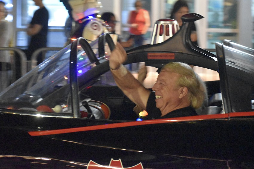 Eugene Nock waves from the Batmobile.