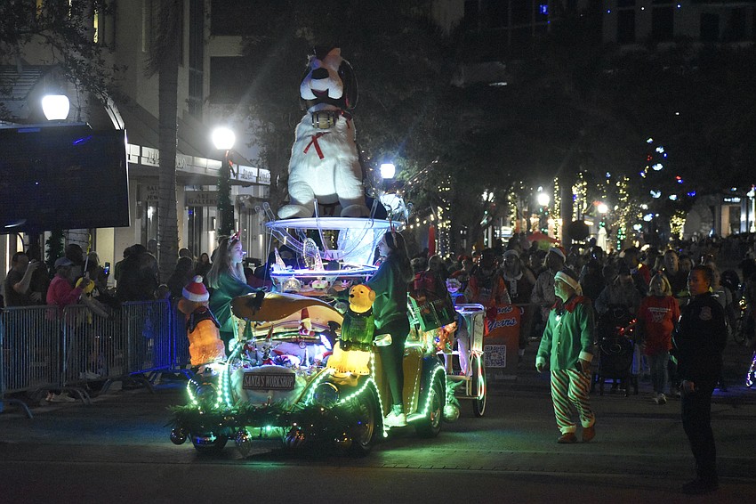 A Santa's Workshop vehicle approaches.