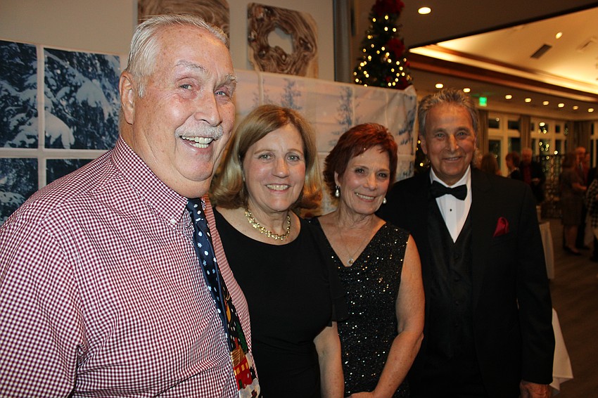 Rick and Monica Rice and Eileen and Bill Strauss enjoy the Rockin' Reindeer Ball. Monica says the event is more proof that they live among some great neighbors.