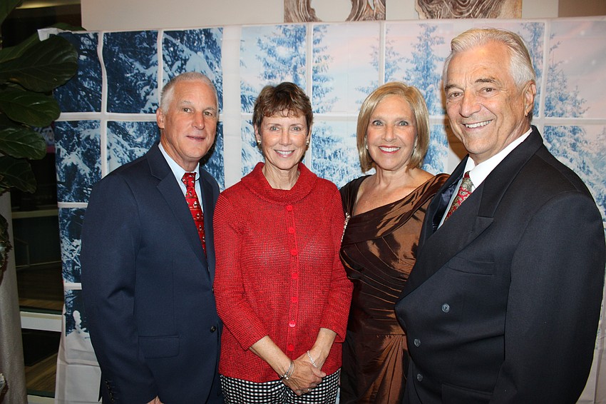 Rob and Rosemary Black join Linda and Bill Pretyka in having a fun night with their River Club neighbors at the Rockin' Reindeer Ball.