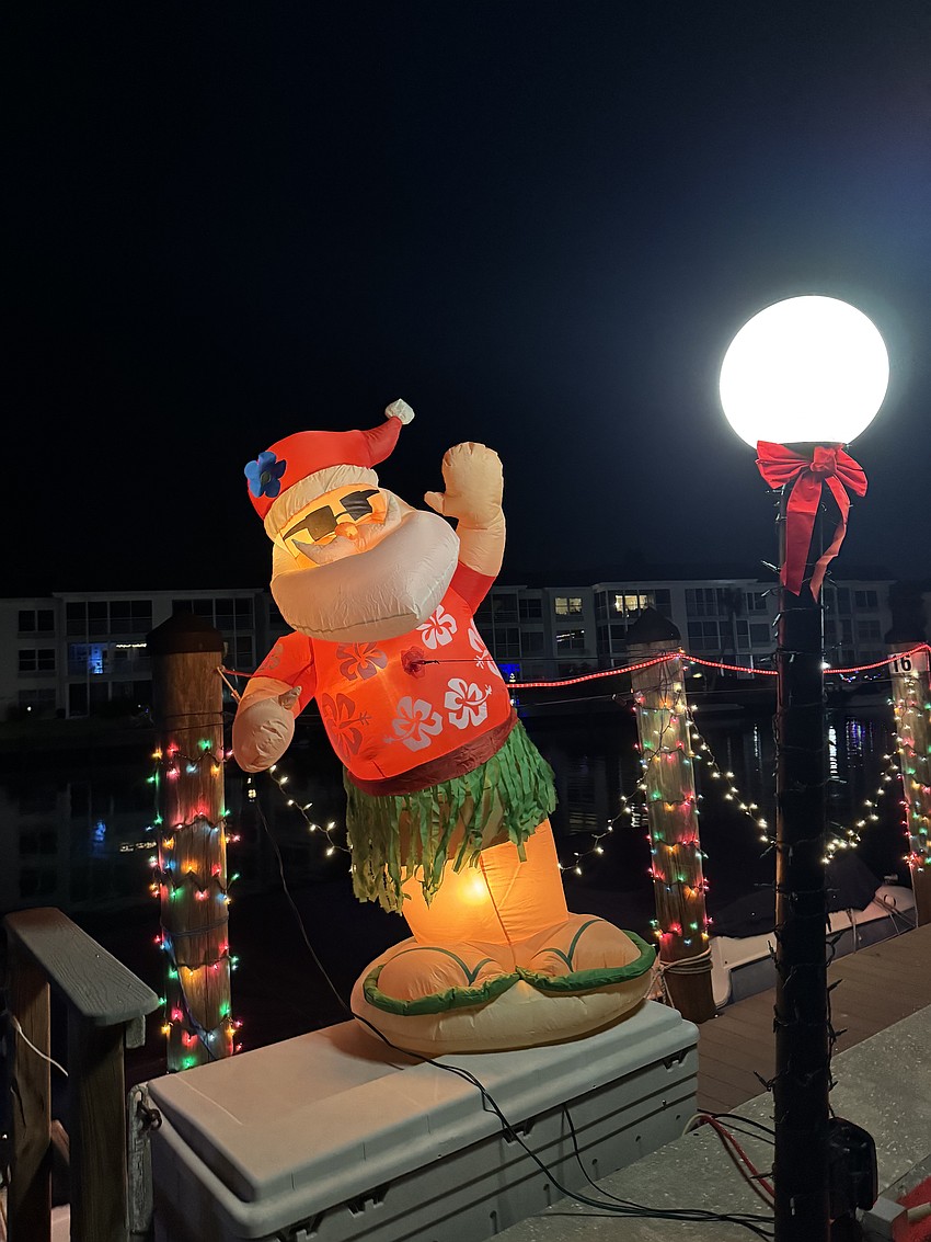 Florida Santa dances to the holiday music at the Lighting of the Docks.