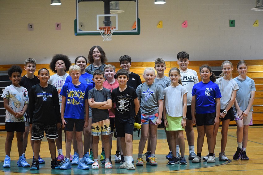 The participants of the Lakewood Ranch-Sarasota Elks Hoop Shoot pose together after competing against each other at Carlos E. Haile Middle School on Monday, Dec. 9.