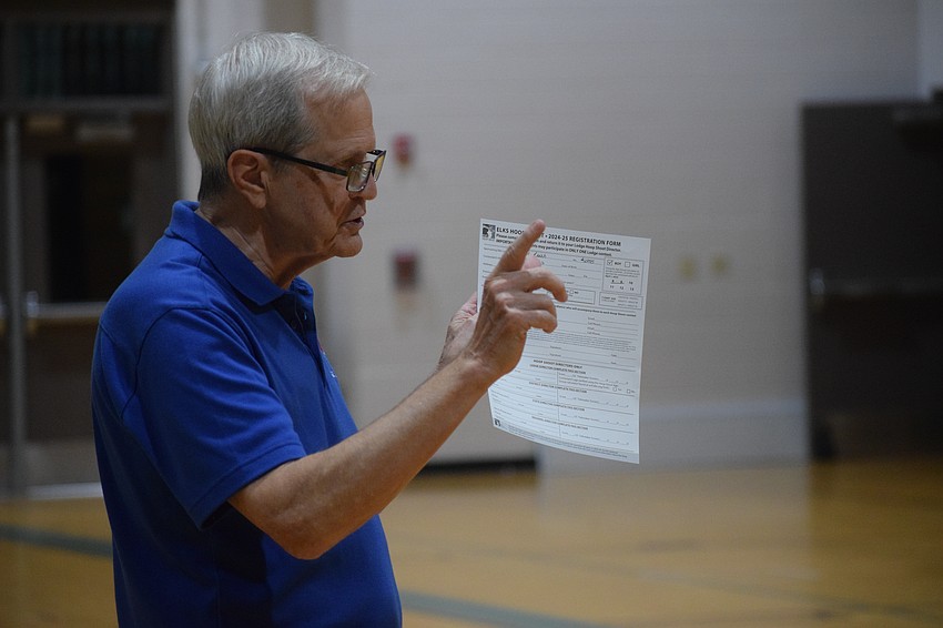Randy Volkart, the organizer of the Lakewood Ranch-Sarasota Elks Hoop Shoot, goes over the final scores and explains how the tournament will continue onto districts for winners at Carlos E. Haile Middle School on Monday, Dec. 9.