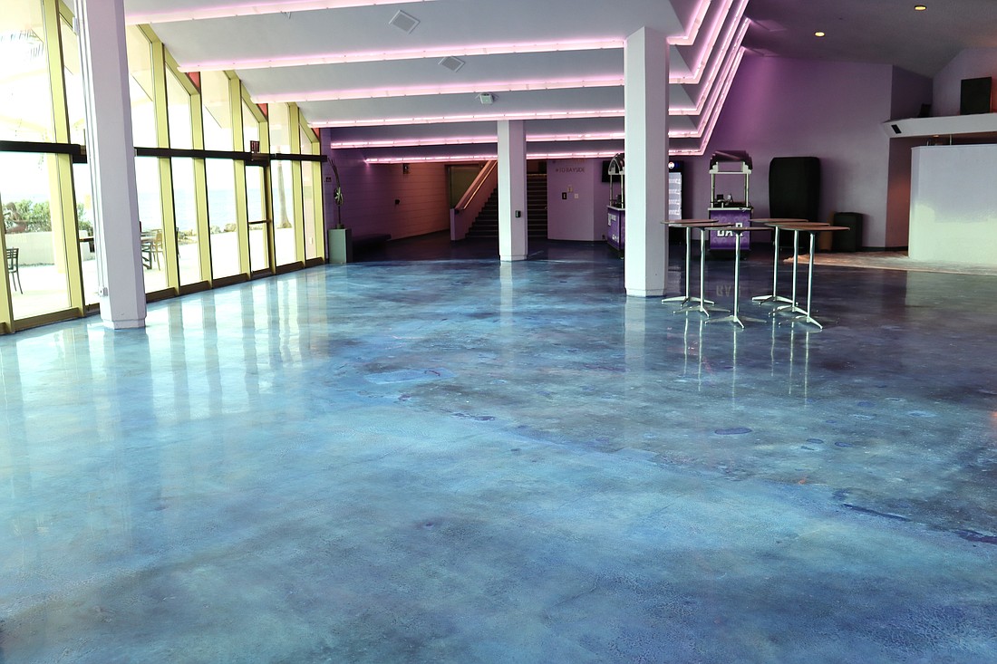 The saturated carpet in the Grand Foyer at Van Wezel Performing Arts Hall has been replaced with polished concrete.