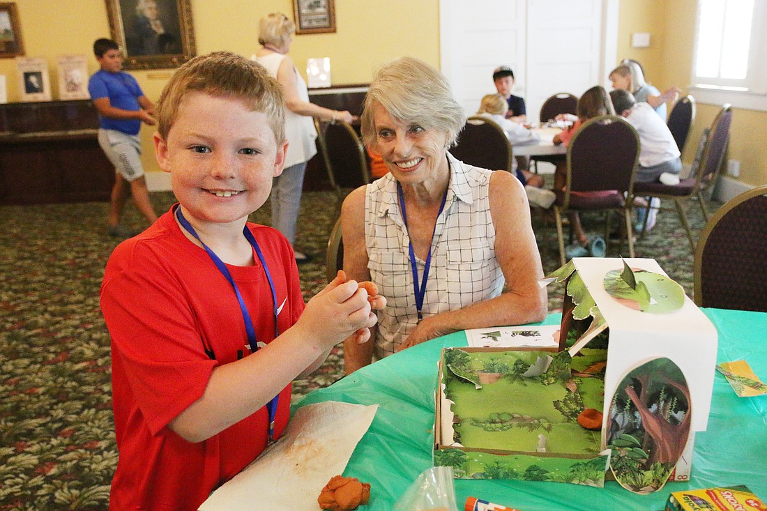 June 11: Aiden makes a dioramas of a sugar mill with the help of camp volunteer Nancy Ruscitti during the inaugural OBHS summer camp. Photo by Jarleene Almenas
