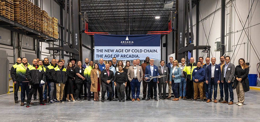 Officials prepare to cut the ribbon Dec. 5 for the nearly $87 million Arcadia Cold Storage & Logistics facility in North Jacksonville.