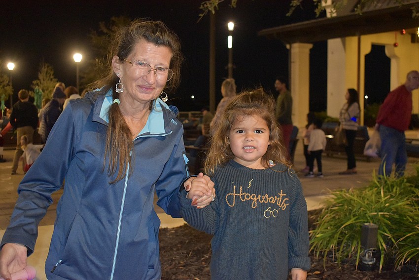 Lakewood Ranch's Donna Israni walks her 3-year-old granddaughter in circles as they wait for their turn with Santa.