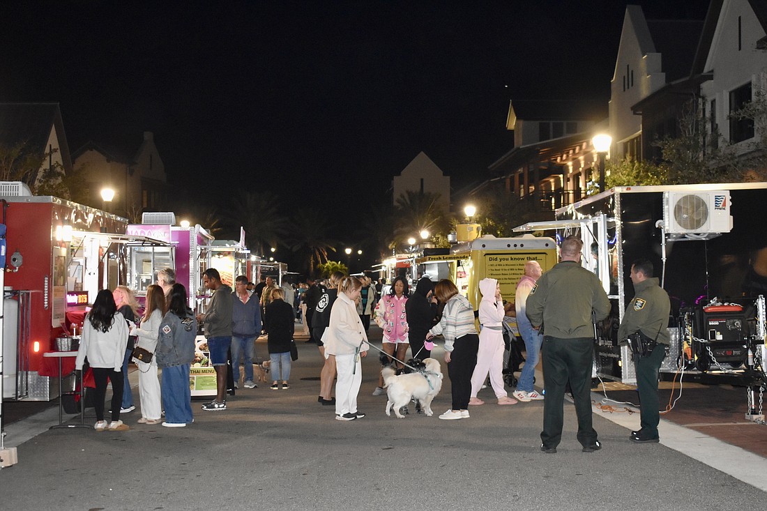 Guests line up for food trucks at Ranch Nite Wednesday on Dec. 11 at Waterside Place.