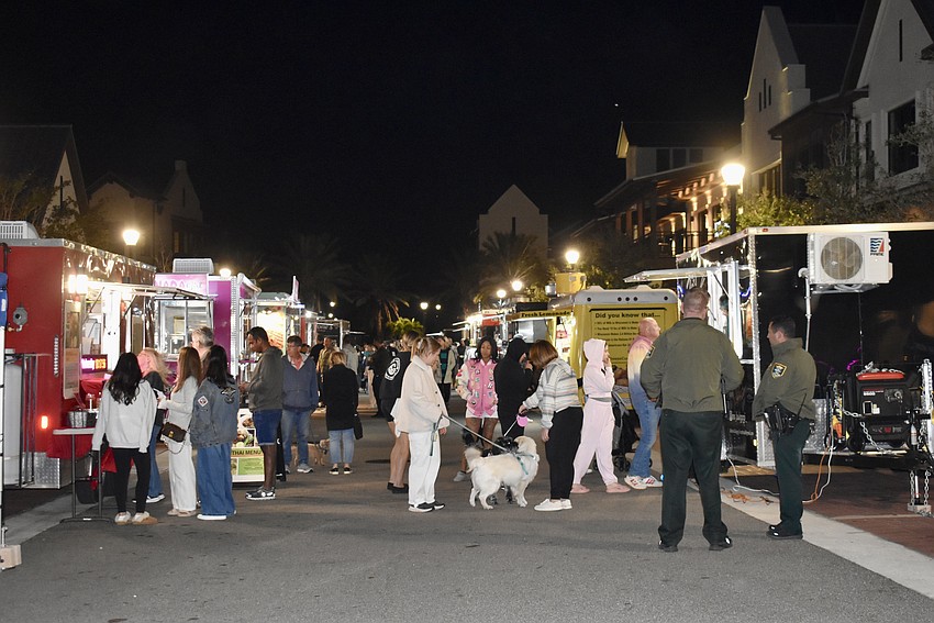 Guests line up for food trucks at Ranch Nite Wednesday on Dec. 11 at Waterside Place.