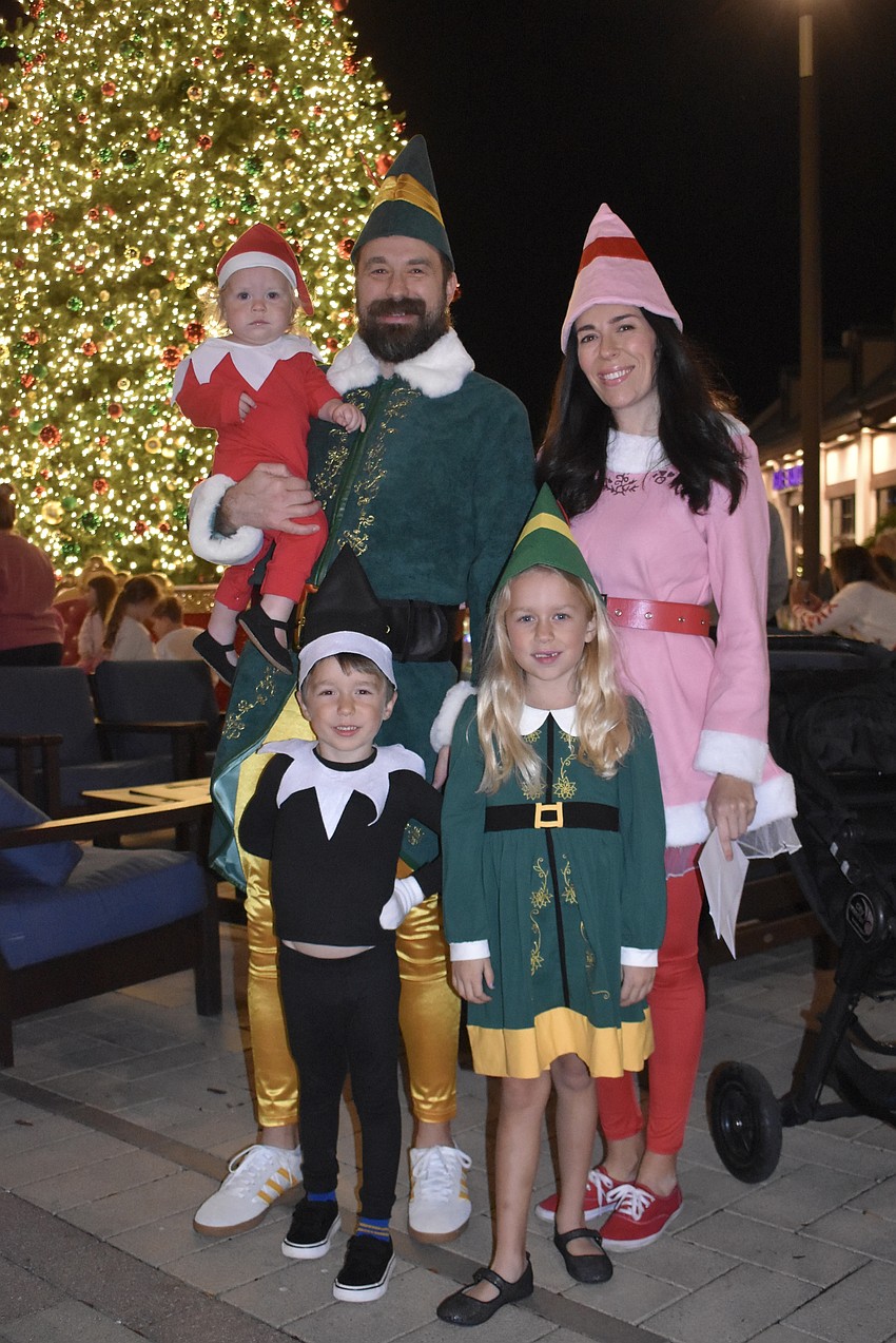 Lakewood Ranch's Phillip and Summer Saxton bring their children Sadie, Archer and Joelle to Waterside Place for a festive photo with Santa.