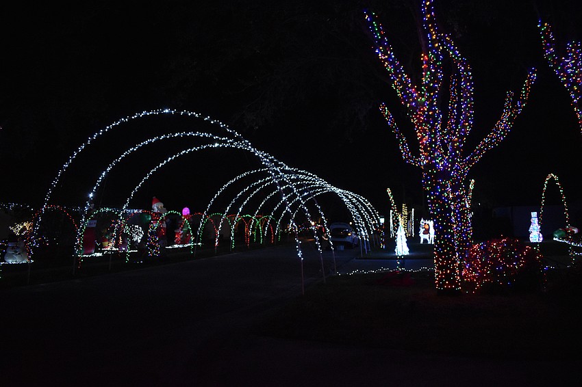 An archway covers a part of Eastwind Drive in Three Oaks