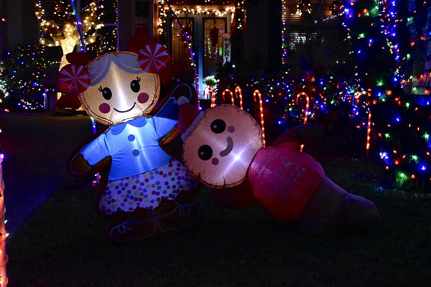 Inflatable dolls decorate the yard of 5624 Eastwind Drive in the Three Oaks neighborhood.