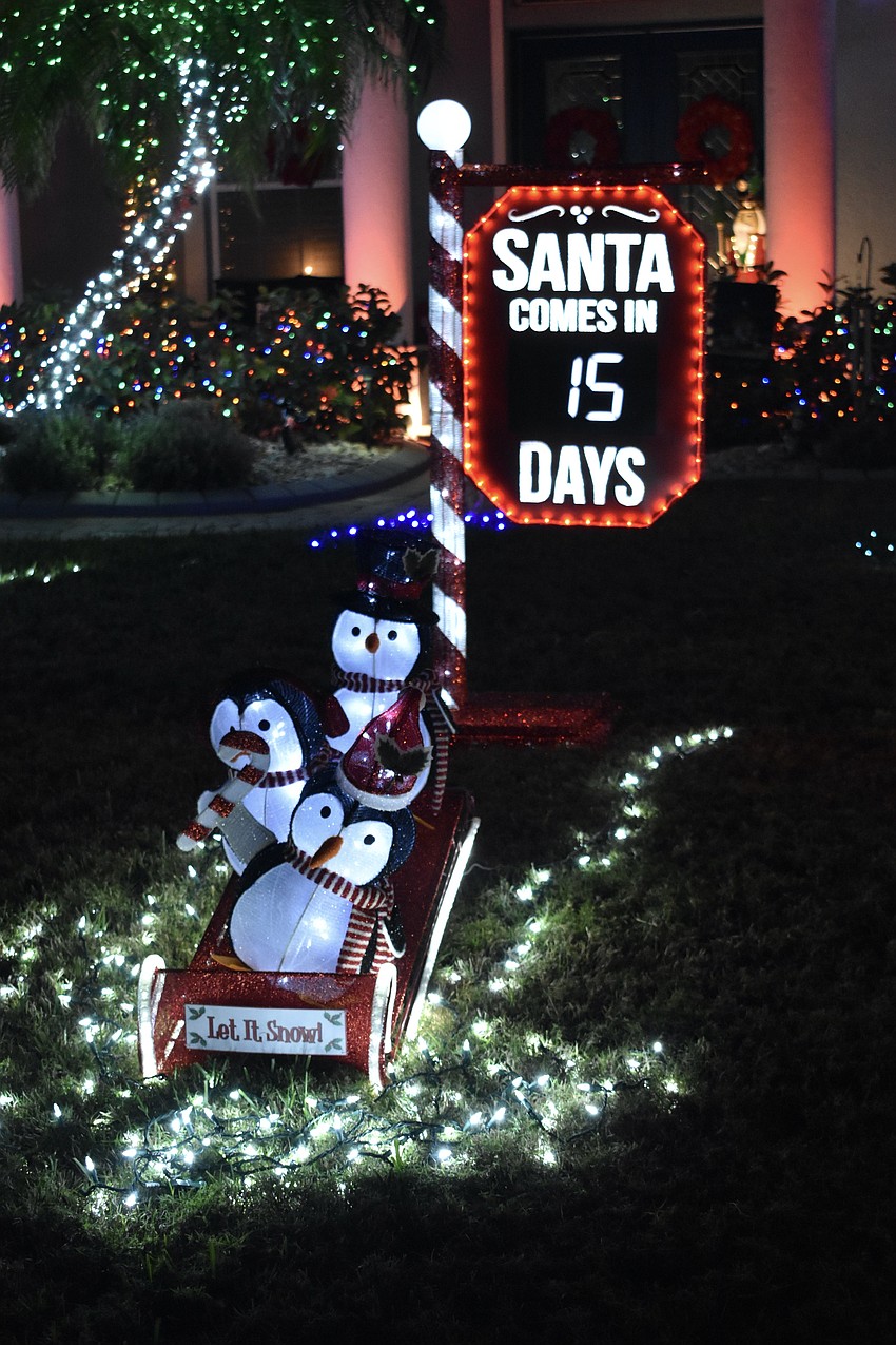 A Christmas countown screen is included in the display front of Bill and Connie Johnson's home at 5568 Eastwind Drive in the Three Oaks neighborhood.