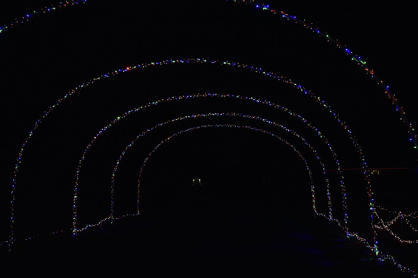 An archway covers the street in Cedar Hollow