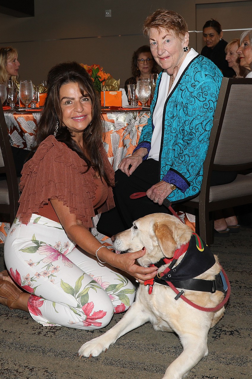 Ileana Neumann sits with Lulu who takes care of her human, Marion Shields.