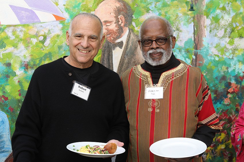 Robert Slackman and Washington Hill ease through the Rise & Shine Brunch buffet line.