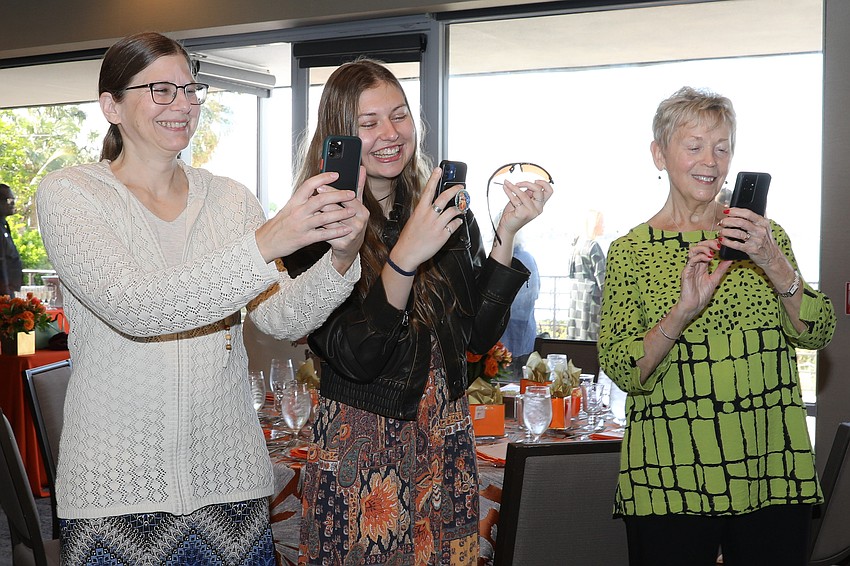 Jen Stotlar, Evelyn Lamb and Joyce Gregory photograph their family.