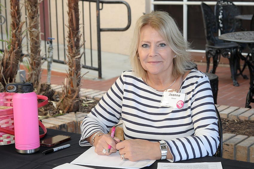 Joanne Stoner is the PPSWCF board liaison and registers guests at the Rise & Shine Brunch.