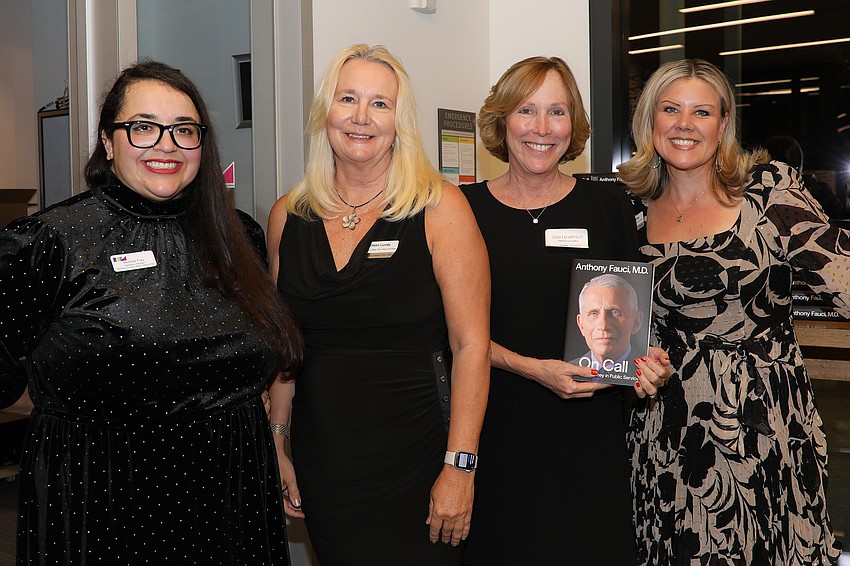 Michelle Frau, Eileen Lundy, Lisa Lenveson and Cheryl Munday pass out signed copies of Dr. Anthony Fauci's book, 