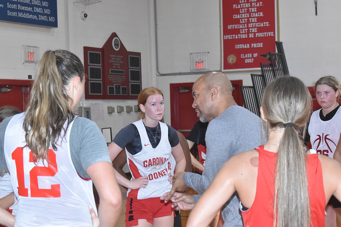 Cardinal Mooney High girls' varsity basketball Head Coach Marlon Williams instructs his team during practice on Dec. 5.