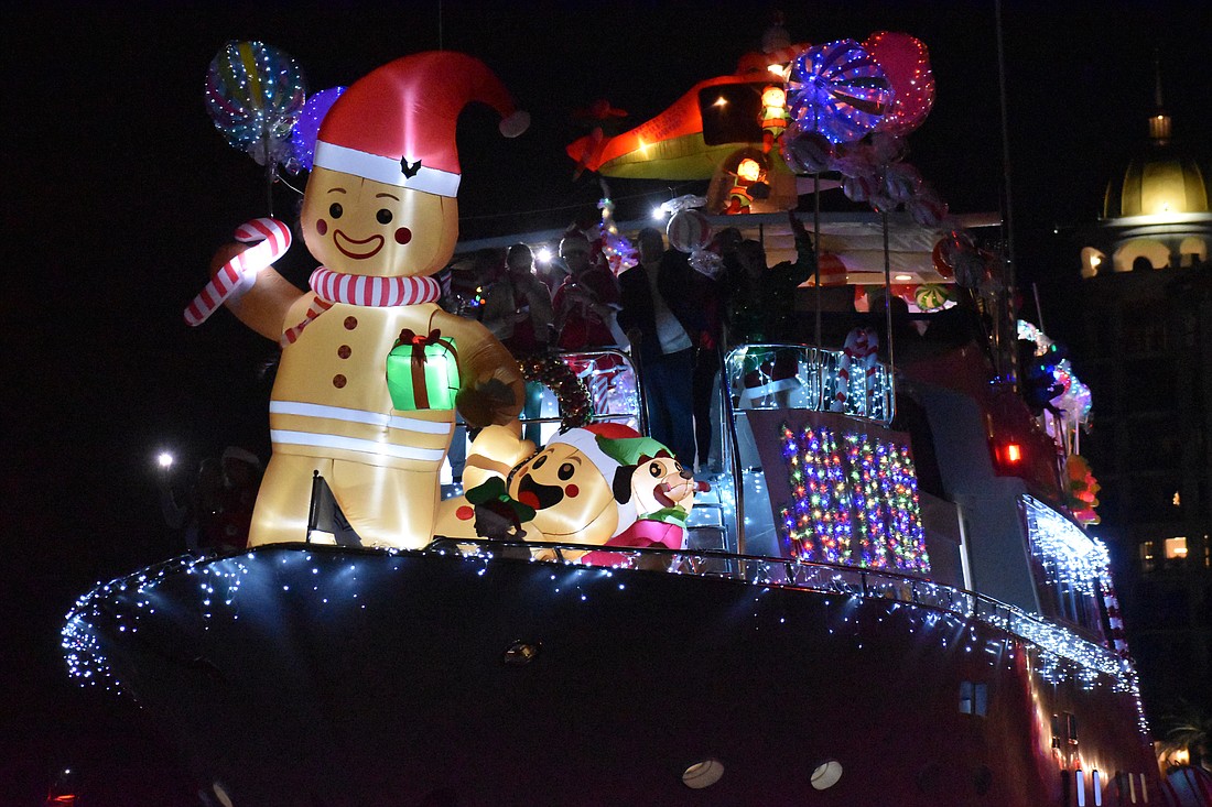 The "Lotus" yacht arrives with a "Joy to SRQ" theme.