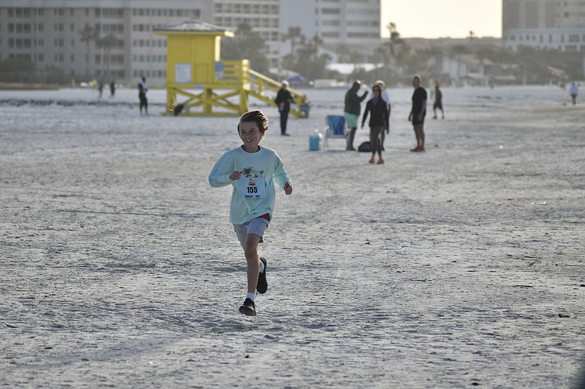 Finn Shkor, 12, approaches the finish line.