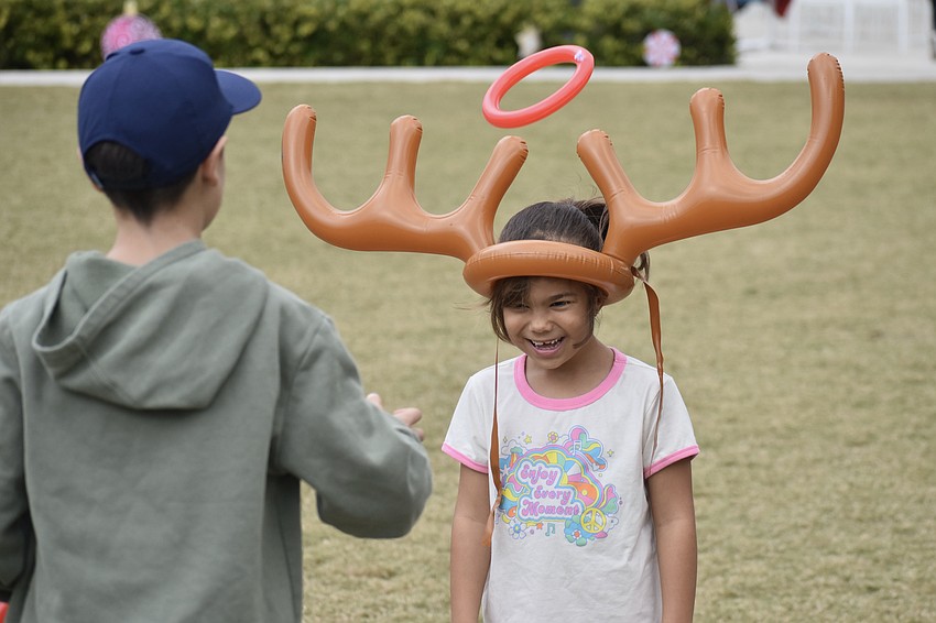 David Neamtu, 11, throws rings to Mariuca Surdu, 6.