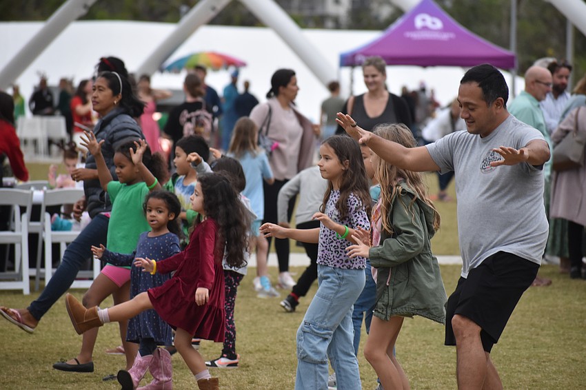 Attendees dance with Mr. Stevey.