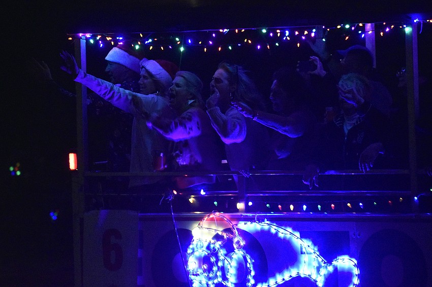 The crew waves to parade viewers from the 