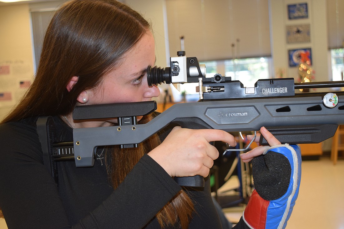 Rachel Walmsley lines up a shot during shooting practice at Braden River High School on Thursday, Dec. 12.