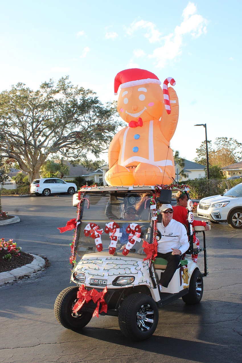 Tom Garvey earned some attention with his cart decoration as he drove up to the Tara Holiday Golf Cart Parade.