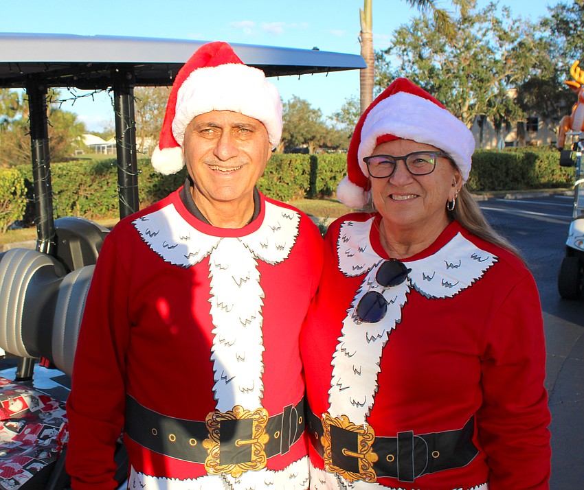 John and Laura Bourjaily were in the lead cart because John was the Tara Holiday Golf Cart Parade grand marshal.