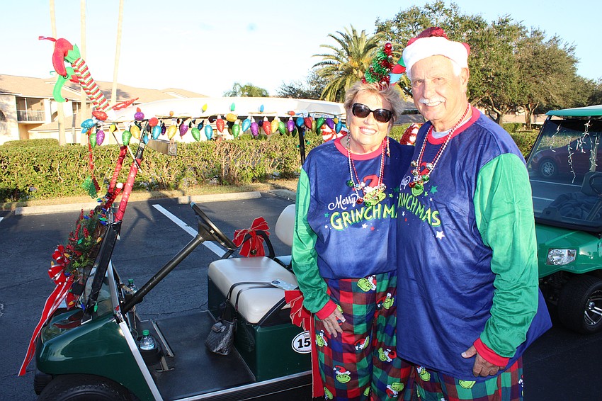 For a pair of Grinches, Bonny and Tony Palmeri certainly were smiling a lot during the Tara Holiday Golf Cart Parade on Dec. 13.