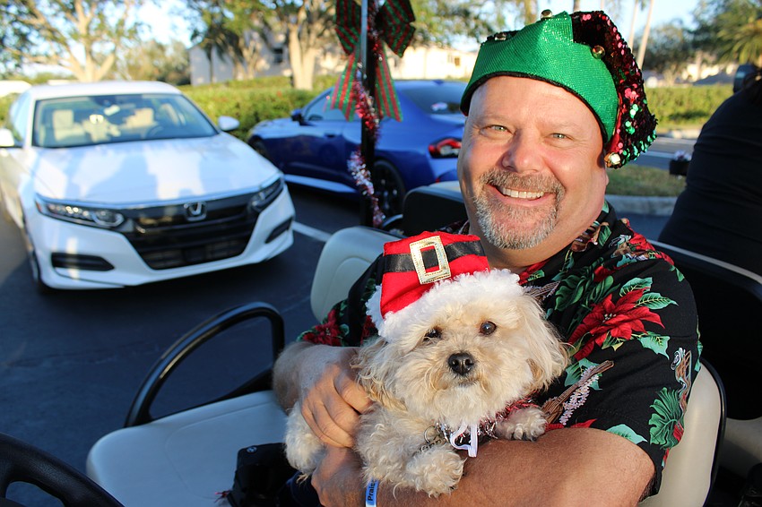 Brian Acklin and Finn sport some festive hats as they get ready to begin the parade.
