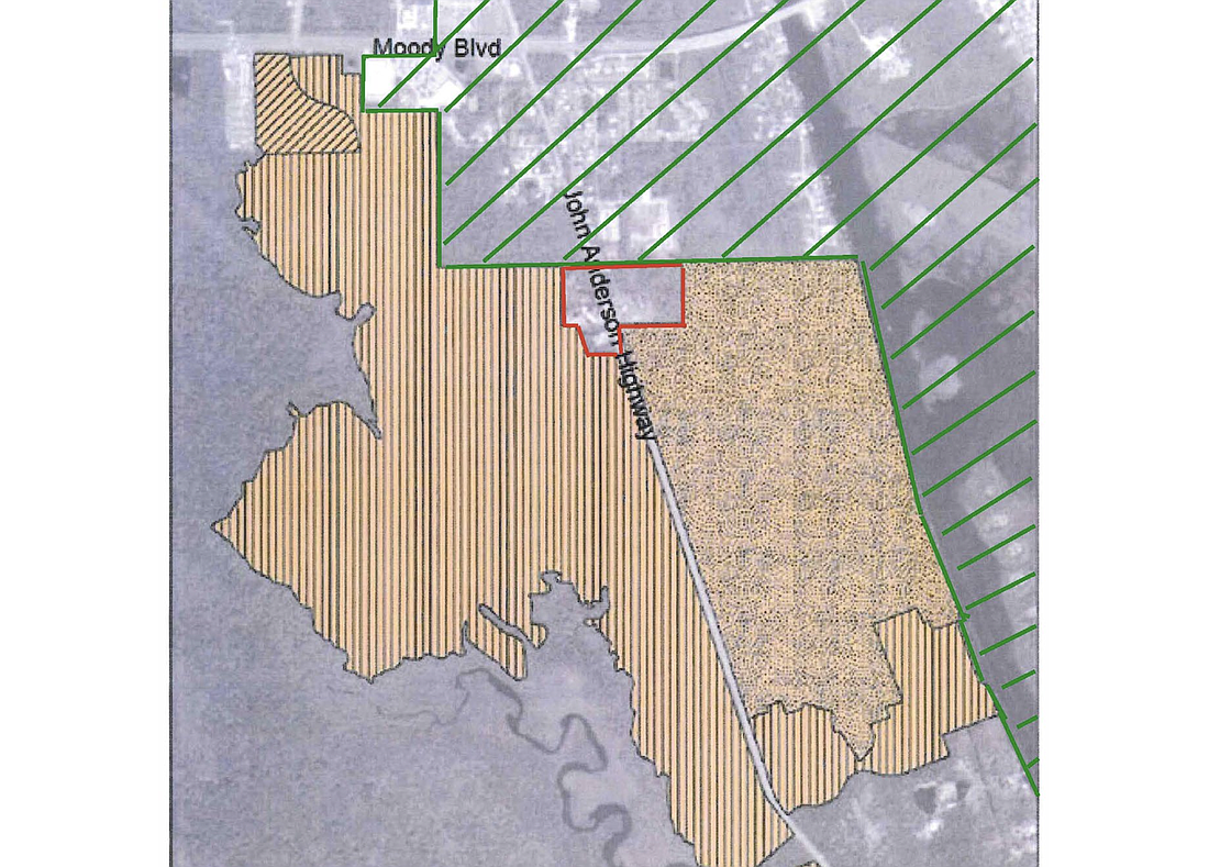 A map of the Veranda Bay development, in orange, and Flagler Beach's current city limits in the green stripes. The red outlined area is allegedly where a "pocket" of Flagler County land would remain. Image from Flagler Beach legal document